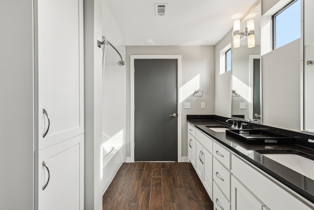 bathroom featuring vanity and tub / shower combination