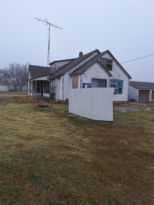 view of property exterior featuring a yard and cooling unit