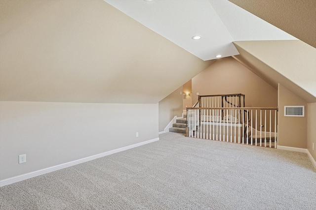 bonus room featuring lofted ceiling and carpet floors