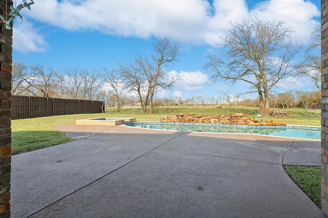 view of patio featuring a swimming pool with hot tub