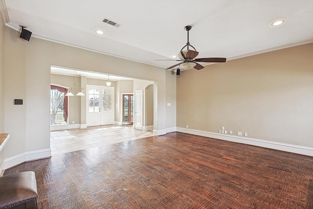 unfurnished living room with crown molding, hardwood / wood-style floors, and ceiling fan