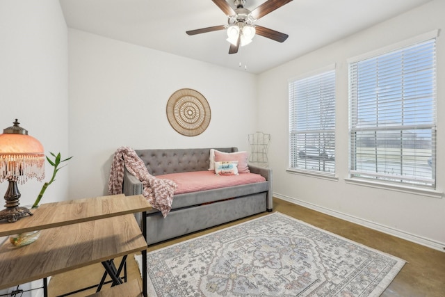 living area with ceiling fan