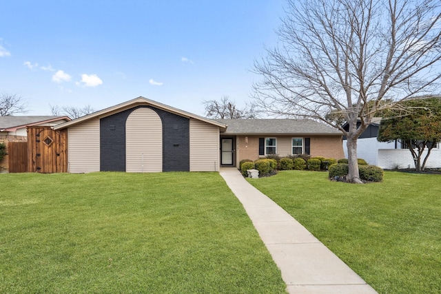 ranch-style house featuring a front lawn