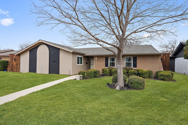 single story home featuring a front yard