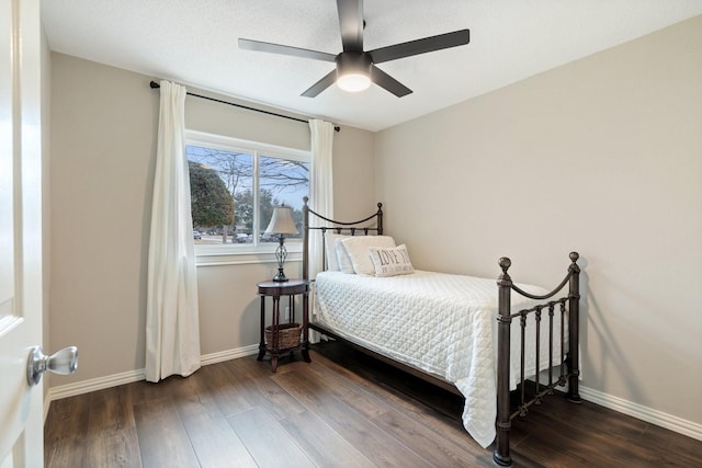 bedroom with dark wood-type flooring and ceiling fan