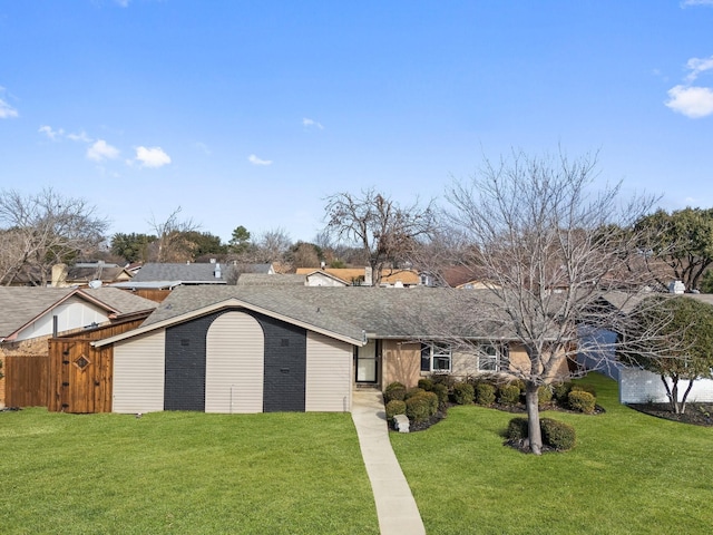 single story home with a front lawn