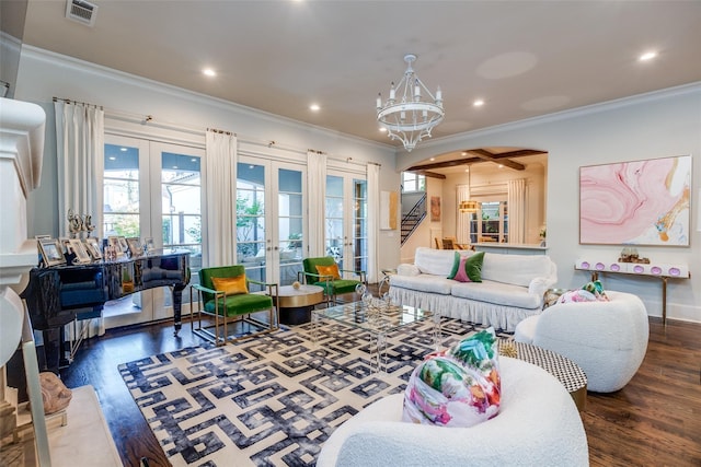 living room with dark hardwood / wood-style flooring, a notable chandelier, ornamental molding, and french doors