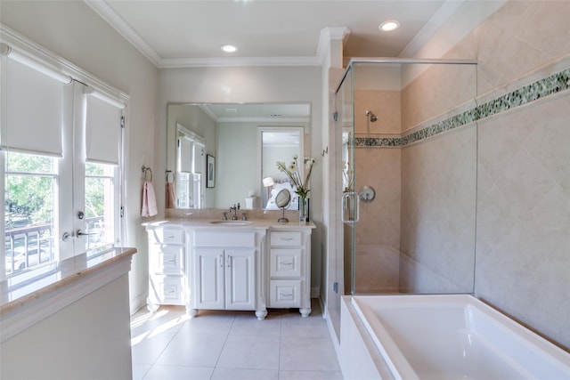 bathroom featuring vanity, crown molding, tile patterned floors, and separate shower and tub