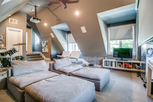 living room featuring lofted ceiling, light colored carpet, and ceiling fan