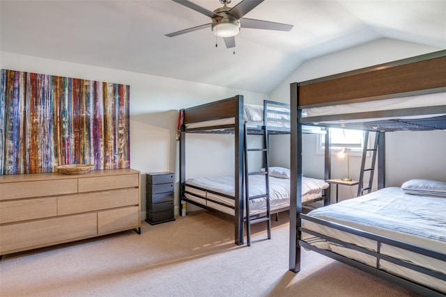 bedroom with lofted ceiling, light carpet, and ceiling fan