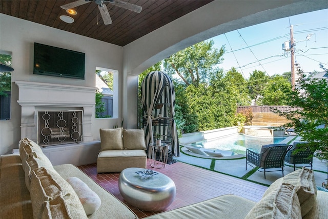 view of patio featuring an outdoor living space with a fireplace, a swimming pool side deck, and ceiling fan