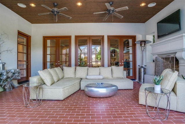 living room with wood ceiling, ceiling fan, and french doors