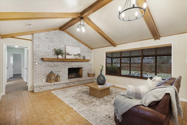 living room with vaulted ceiling with beams, a notable chandelier, and a brick fireplace