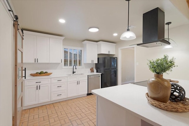 kitchen featuring sink, black fridge, island range hood, stainless steel dishwasher, and white cabinets