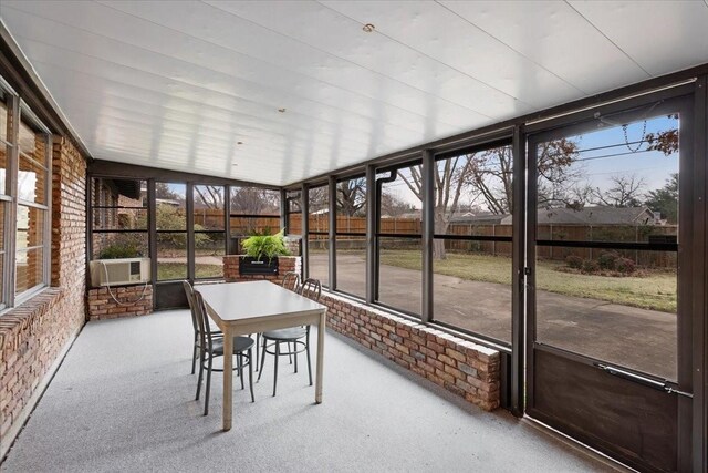 unfurnished sunroom featuring cooling unit