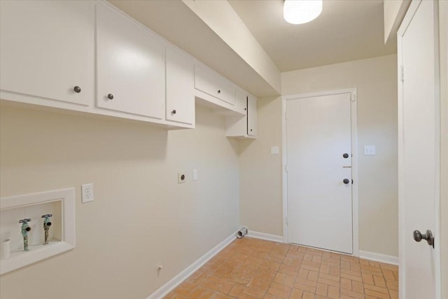 washroom featuring cabinets, washer hookup, and electric dryer hookup