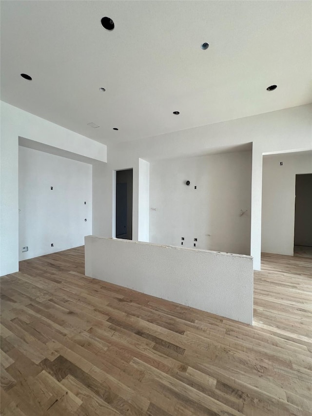 spare room with light wood-style floors