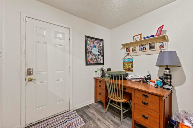 office featuring dark hardwood / wood-style flooring and a textured ceiling