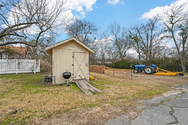 view of outdoor structure with a lawn