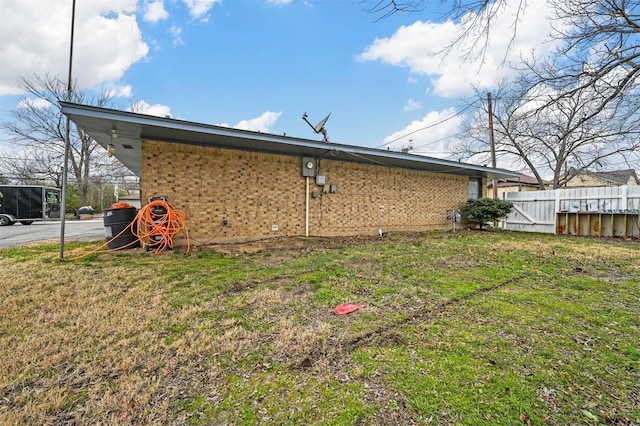 view of home's exterior with a lawn