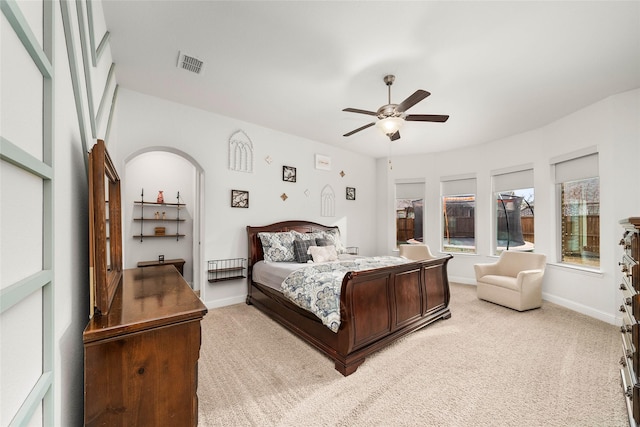 bedroom with light colored carpet and ceiling fan