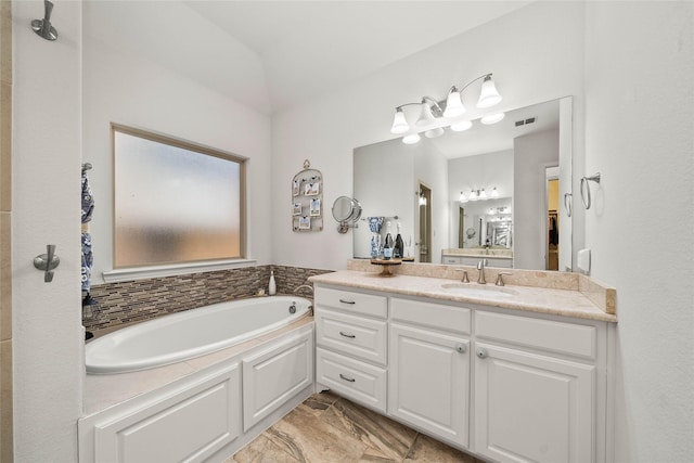 bathroom with vanity and a bathing tub