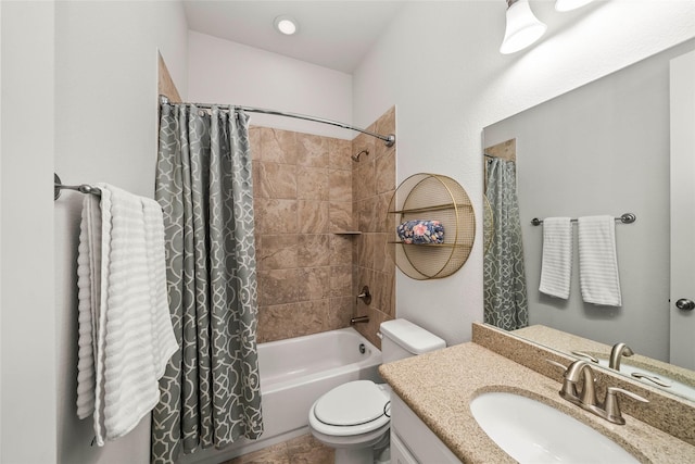 full bathroom featuring shower / bath combination with curtain, vanity, and toilet