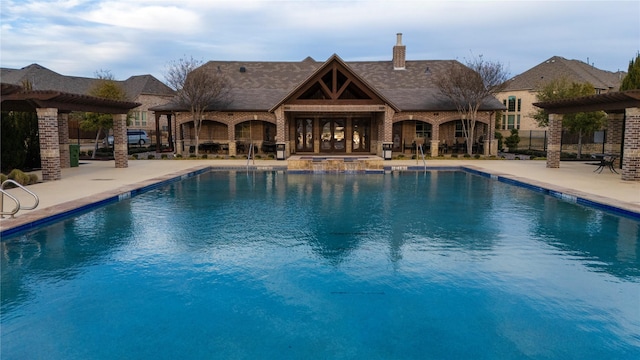 view of pool featuring a pergola and a patio