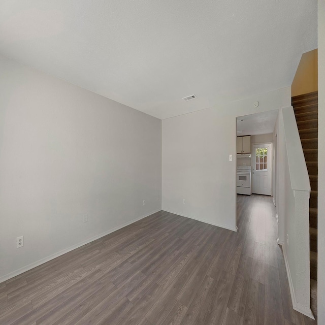 unfurnished room with wood-type flooring