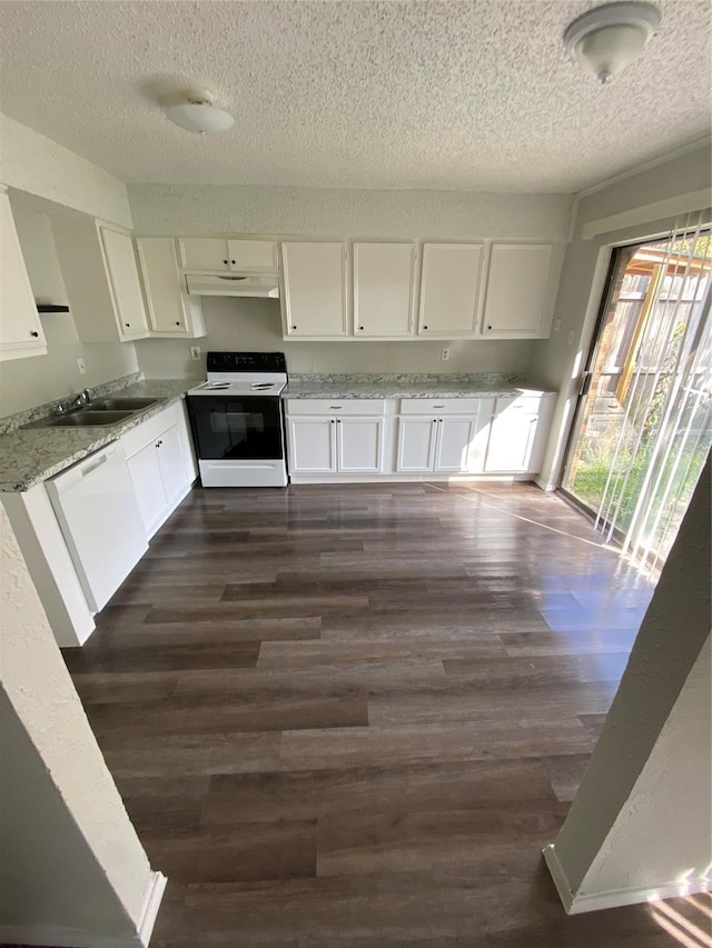 kitchen featuring electric stove, white cabinetry, dark hardwood / wood-style floors, white dishwasher, and light stone countertops