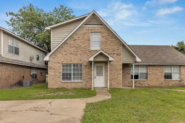 front of property featuring cooling unit and a front yard