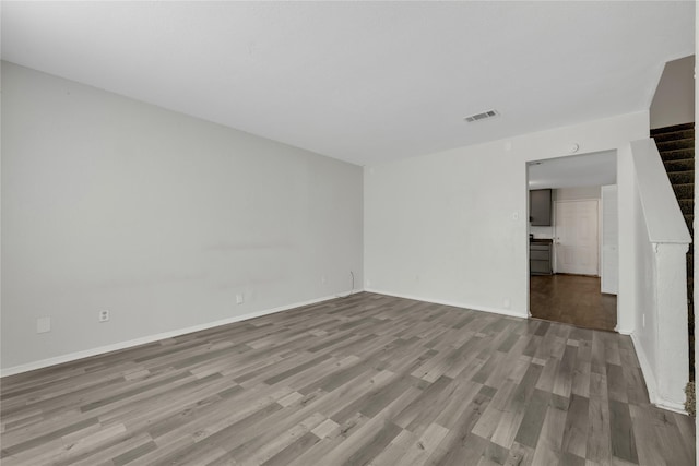 spare room with light hardwood / wood-style flooring