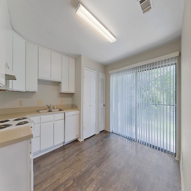 kitchen with white cabinetry, dark hardwood / wood-style flooring, sink, and white dishwasher