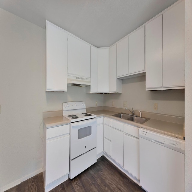 kitchen featuring dark hardwood / wood-style flooring, sink, white appliances, and white cabinets