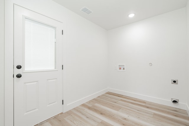 308 Santa Fe, Wolfe City, TX 75496 - washroom featuring light wood finished floors, electric dryer hookup, laundry area, visible vents, and hookup for a washing machine
