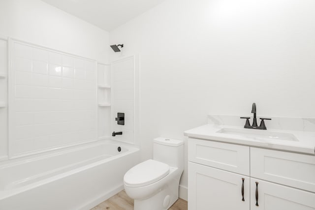 308 Santa Fe, Wolfe City, TX 75496 - full bathroom featuring washtub / shower combination, wood finished floors, toilet, and vanity