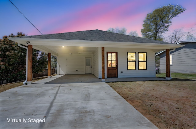 308 Santa Fe, Wolfe City, TX 75496 - view of front of property featuring a shingled roof, driveway, and a carport