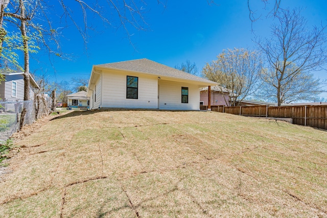 308 Santa Fe, Wolfe City, TX 75496 - back of house with a fenced backyard and a yard