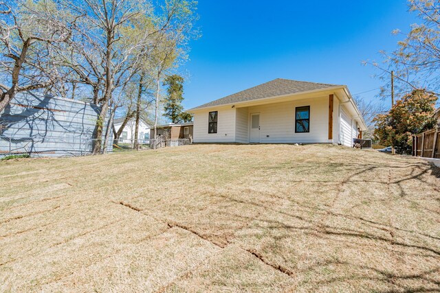 308 Santa Fe, Wolfe City, TX 75496 - rear view of property featuring fence and a yard