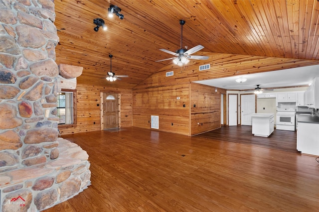 unfurnished living room featuring dark hardwood / wood-style floors, wooden walls, high vaulted ceiling, and wooden ceiling