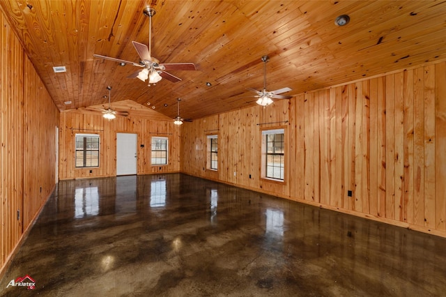 unfurnished room featuring wood ceiling, concrete flooring, vaulted ceiling, and wood walls