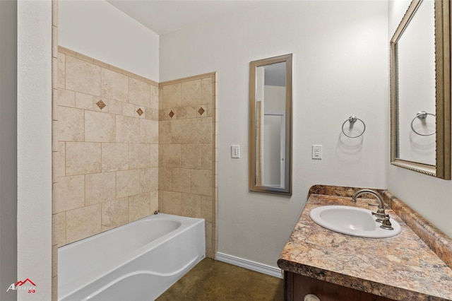 bathroom with vanity and tiled shower / bath combo