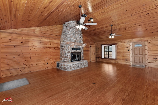 unfurnished living room with high vaulted ceiling, a fireplace, hardwood / wood-style flooring, ceiling fan, and wood ceiling