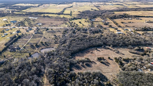 birds eye view of property featuring a rural view