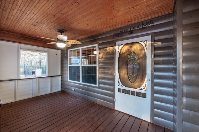 interior space with ceiling fan and covered porch