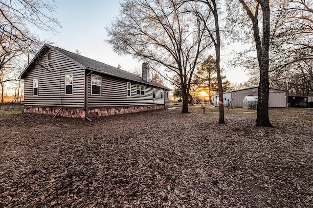 view of property exterior at dusk