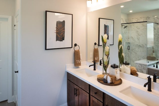 bathroom featuring vanity and a shower with shower door