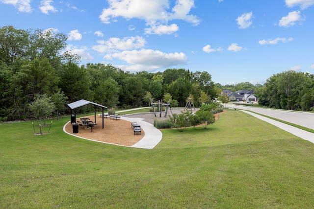 view of home's community with a yard