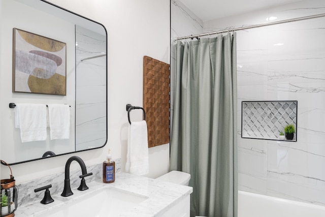 full bathroom featuring vanity, shower / bathtub combination with curtain, and toilet