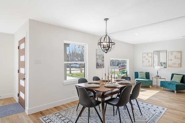 dining space featuring a chandelier, recessed lighting, light wood finished floors, and baseboards